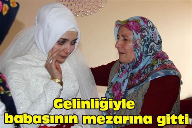 Gelinliğiyle babasının mezarına gitti