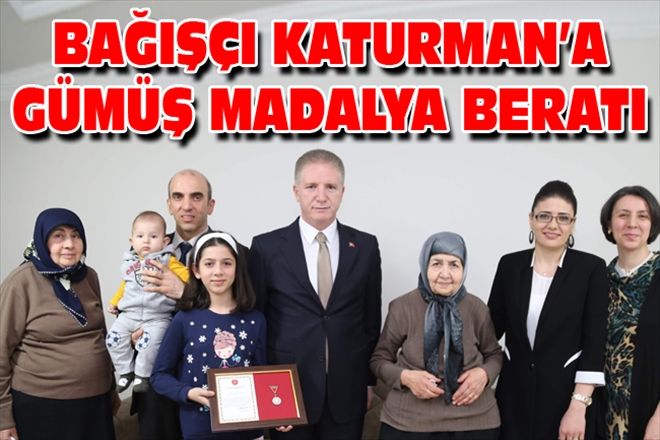 BAĞIŞÇI KATURMAN´A GÜMÜŞ MADALYA BERATI
