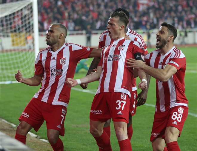 Devlerle Yarışıyor